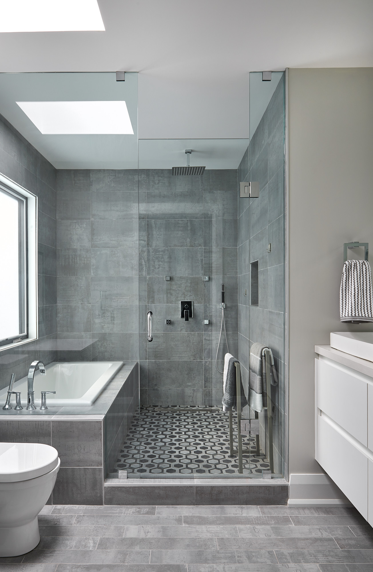 Can you tile over wall tiles in a bathroom?
